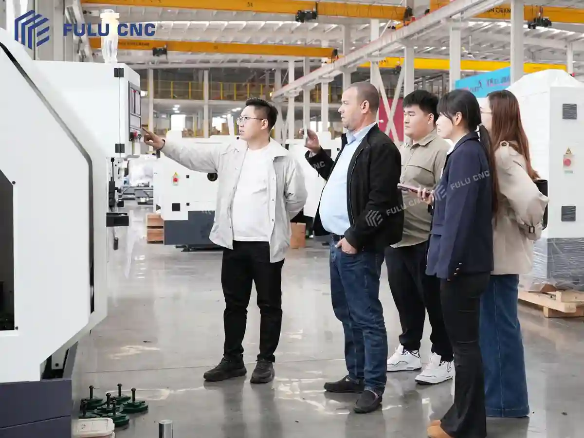 Authorized technical discussion during a FULU CNC customer visit